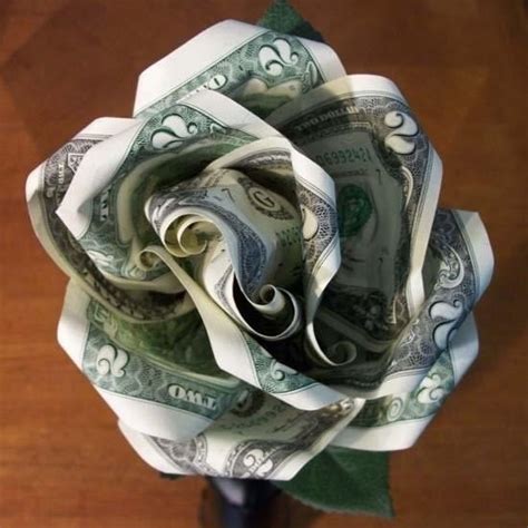 origami flower dollar|how to fold dollar bills into shapes.